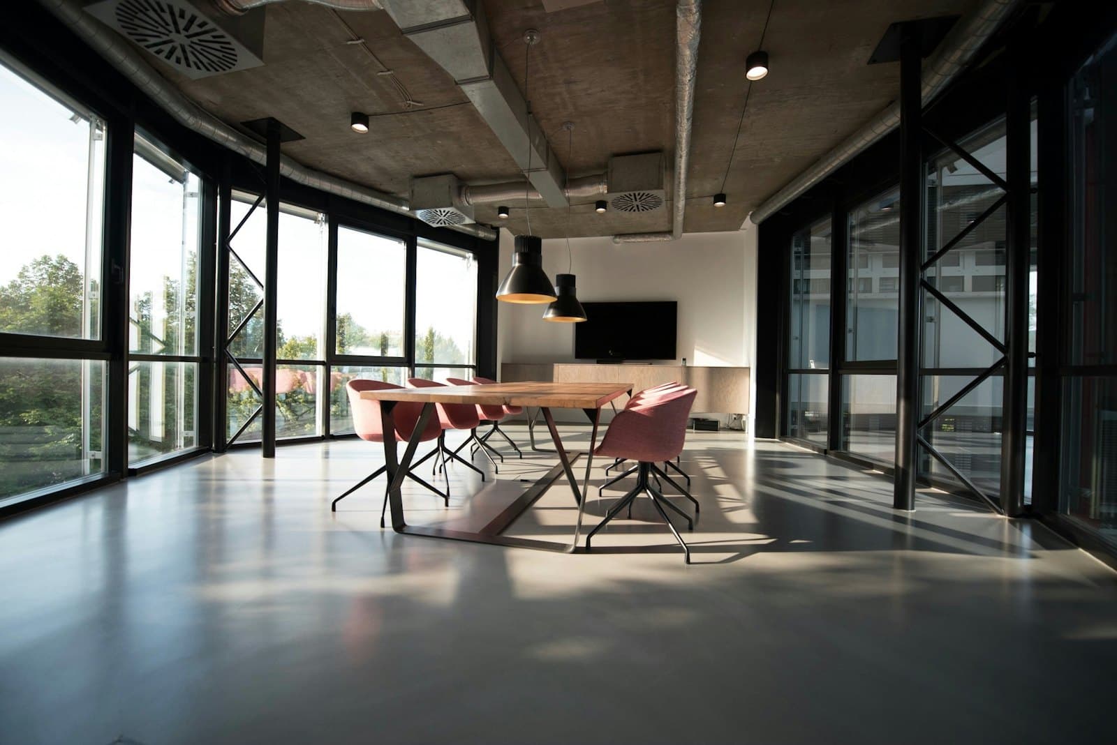 Daylit collaborative workspace · illustrative